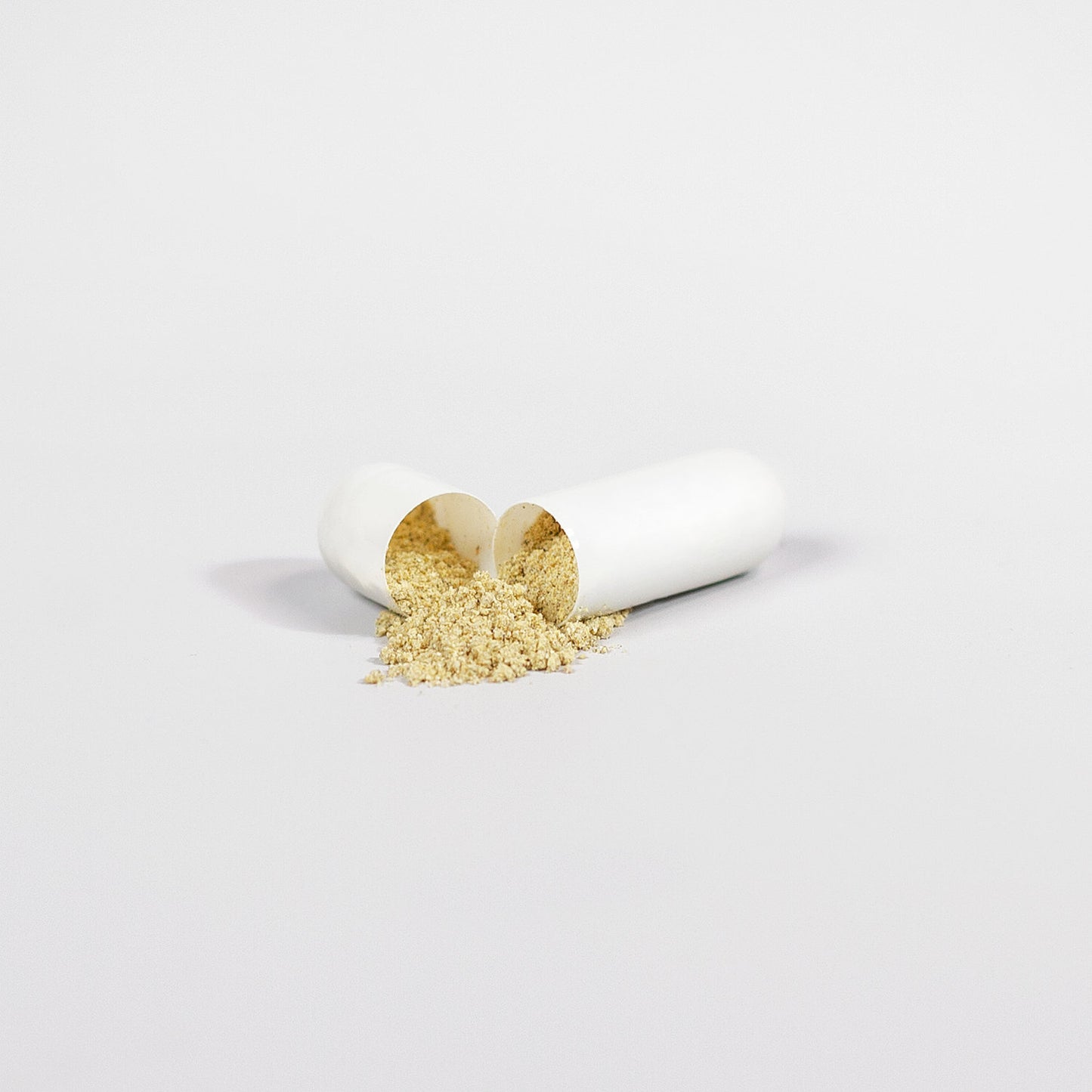 Open capsule of ViableSupps Super Fat Burner with powdered supplement spilling out on a white background