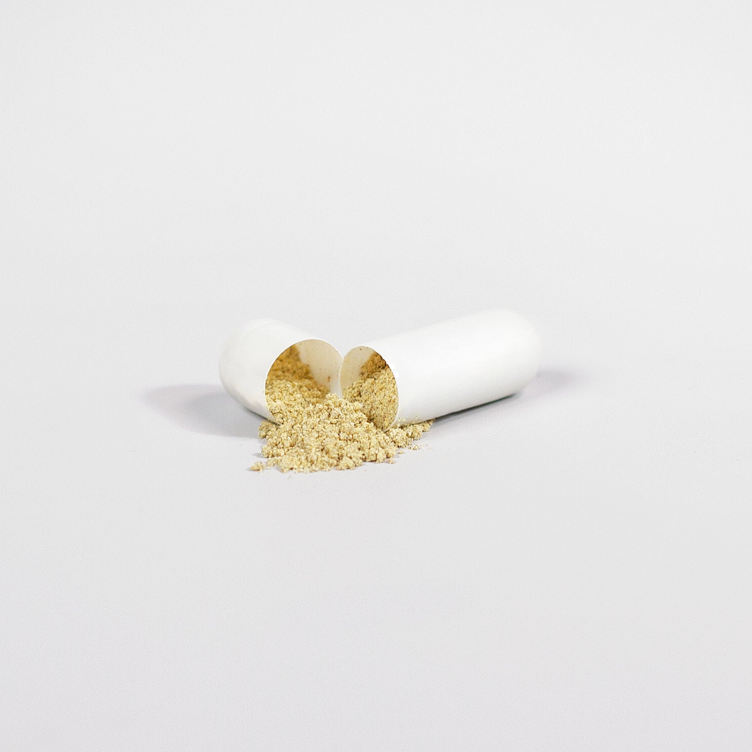 Open capsule of ViableSupps Super Fat Burner with powdered supplement spilling out on a white background