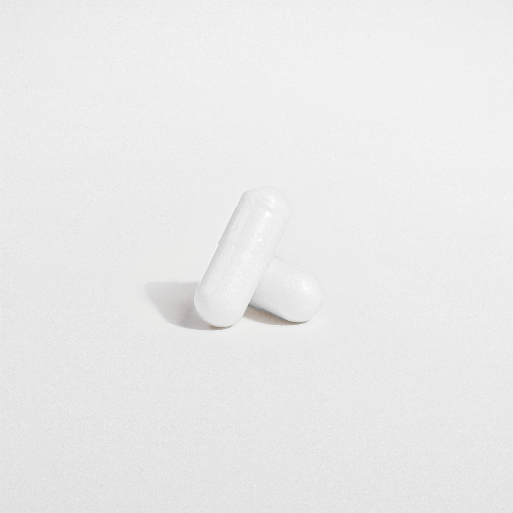 Two white ViableSupps Probiotic 40 Billion capsules on a plain white background.