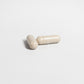 Close-up of two ViableSupps Testosterone Booster capsules on a plain white background.