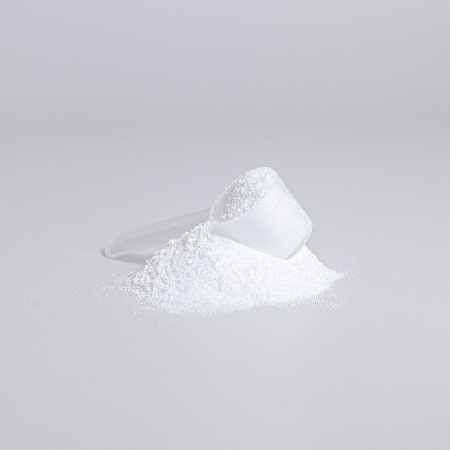 Close-up of a scoop of ViableSupps Creatine Monohydrate powder, showcasing fine, pure creatine for easy mixing.